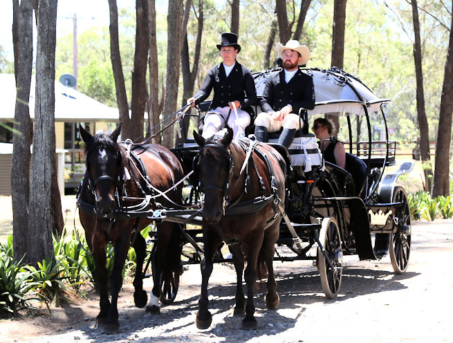 Jess & Gus in the Black Pumkpin Carriage